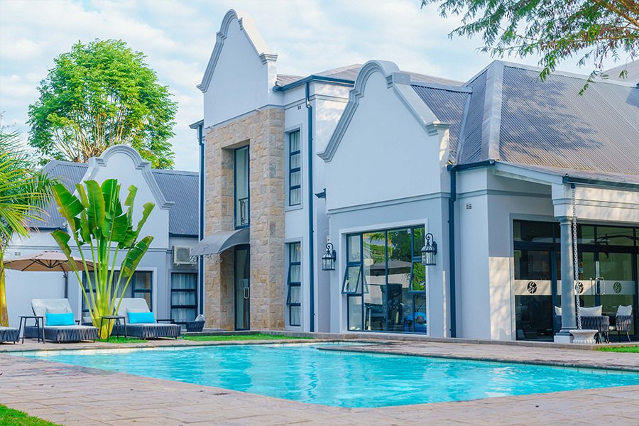 Ezulwini Villa façade and pool in Greendale, Harare
